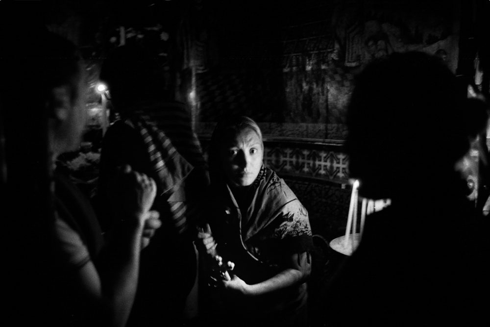  Pilgrim in the Coptic Chapel of the Holy Sepulchre Church. Jerusalem 2011. 