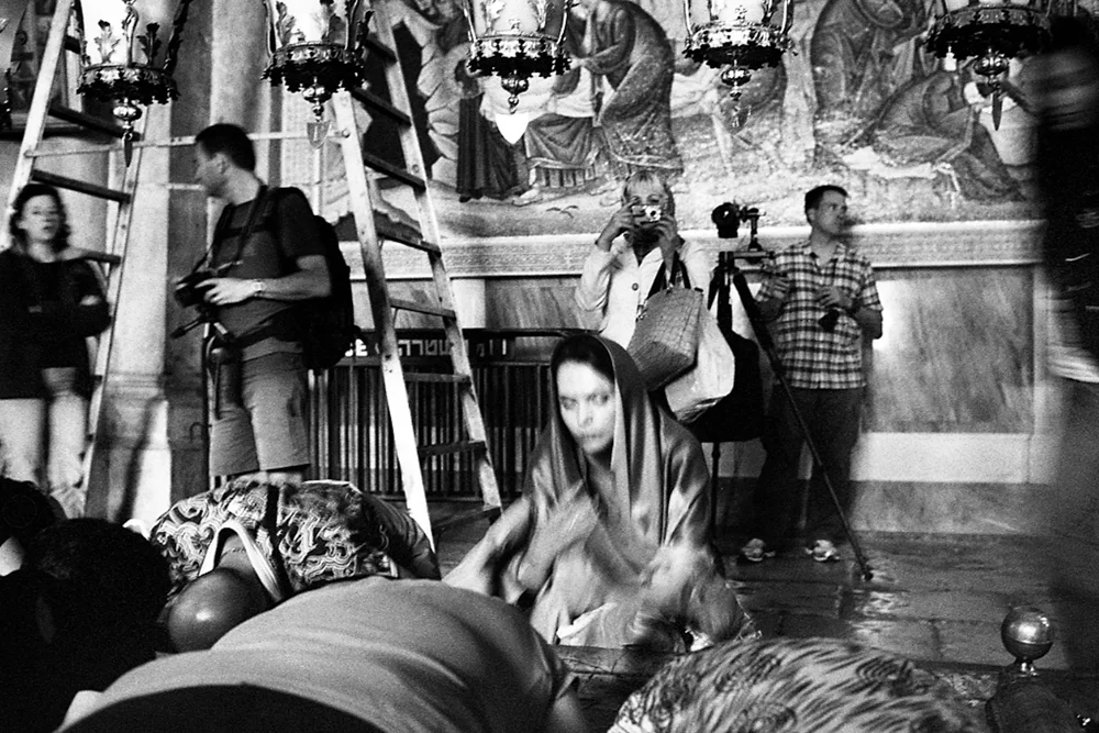  Pilgrim at the Anointing Stone in the Holy Sepulchre Church. Jerusalem 2012. 
