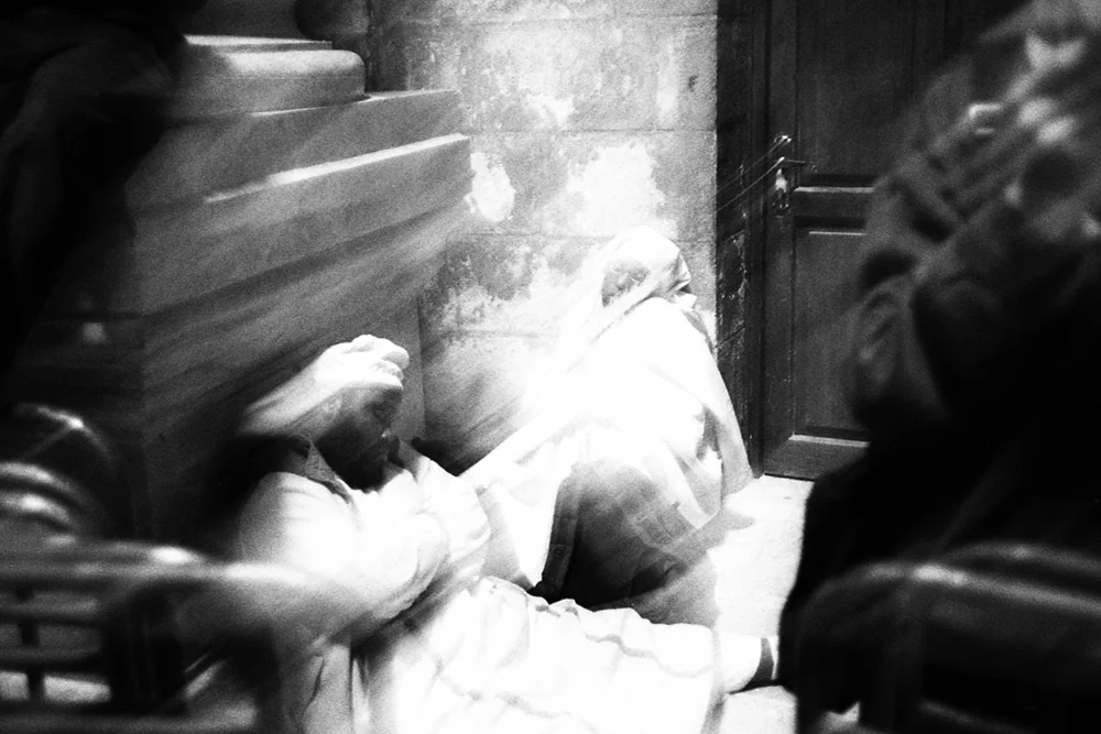  Coptic pilgrims resting in the Holy Sepulchre Church on Holy/Maundy Thursday before Easter. Jerusalem 2012. 
