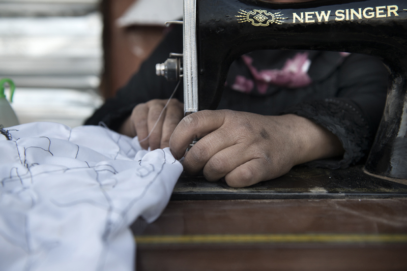 Mariam at the sewing machine that they use for making courses to the women of the community. Mariam after taking a course with UNDP, become a community mobilizer. She and her friend Jihan are working as volunteer in the kindergarden. Also they are o