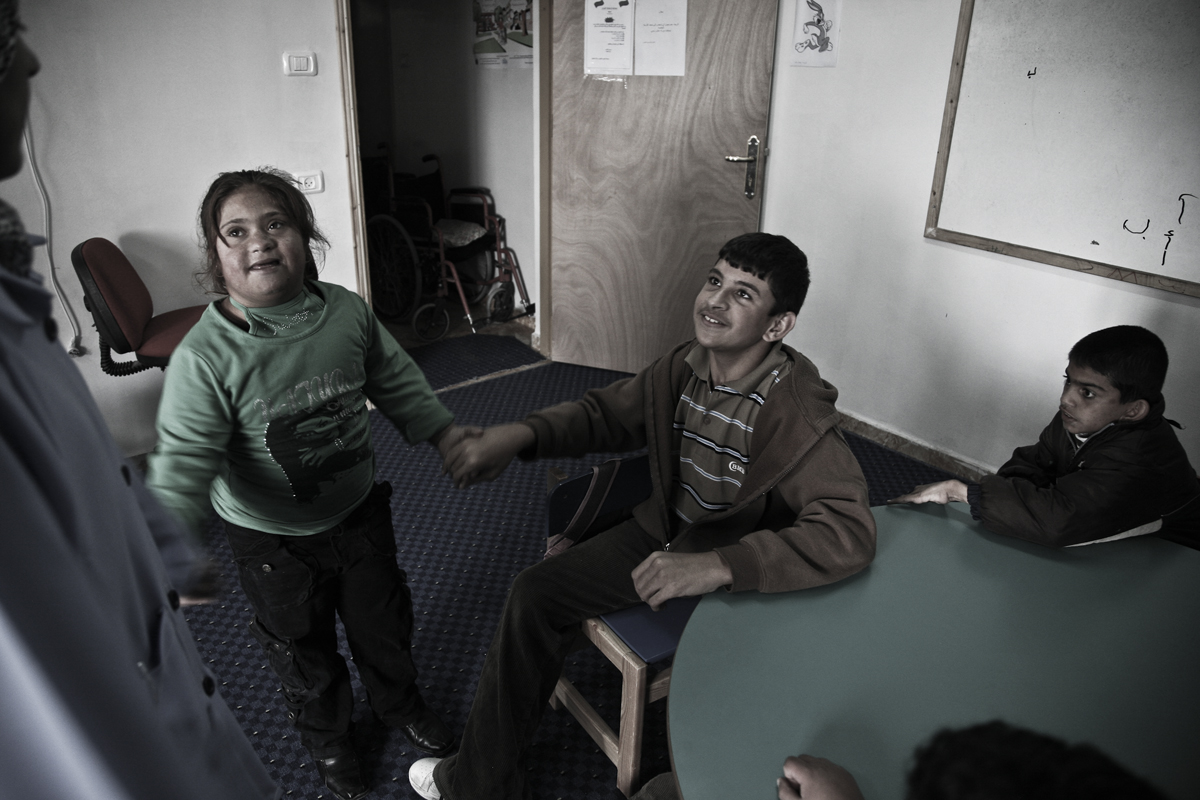 Mohammad at school of D.R.I.C. in Yatta. He suffers from combined disability formed in mobility as a result of polio in the lower half, and in the mean time he depends on wheel chair to move; also his intelligence abilities are limited. The child j
