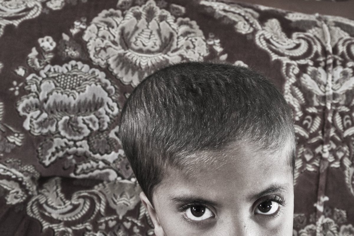 Naseem at his home, he is suffering from a paraplegia at the lower part of his body, as a result of the presence of water in is brain. He is a patient at the rehabilitation center supported by Handicap International in Yatta.