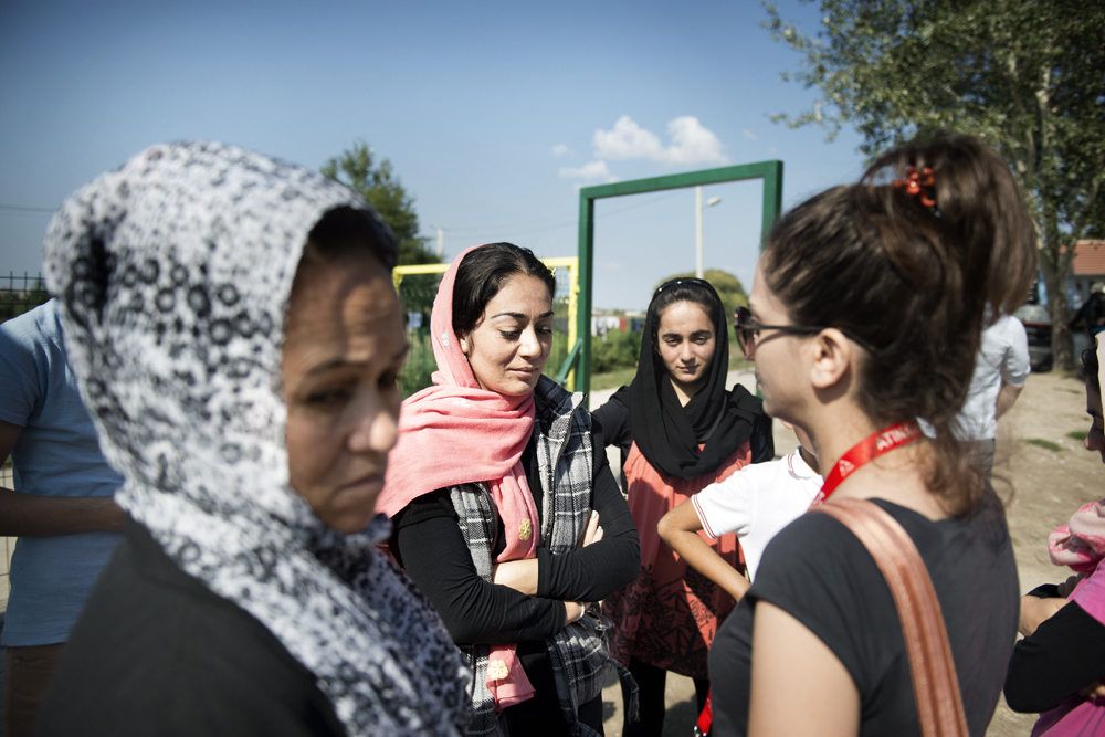 Cultural mediator and Farsi translator Zizi from the Atina outreach team speaks with women at Subotica Transit Centre in Serbia.