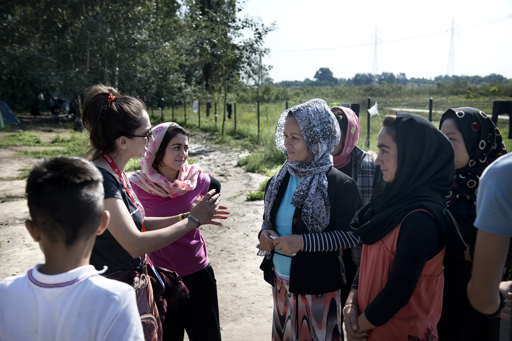 Cultural mediator and Farsi translator Zizi from the Atina outreach team speaks with women at Subotica Transit Centre in Serbia.