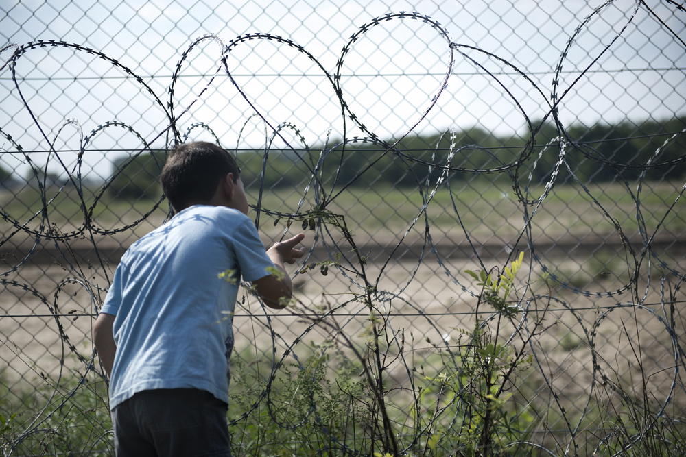 A boy at the Kelebija border crossing at the Serbian border with Hungary.