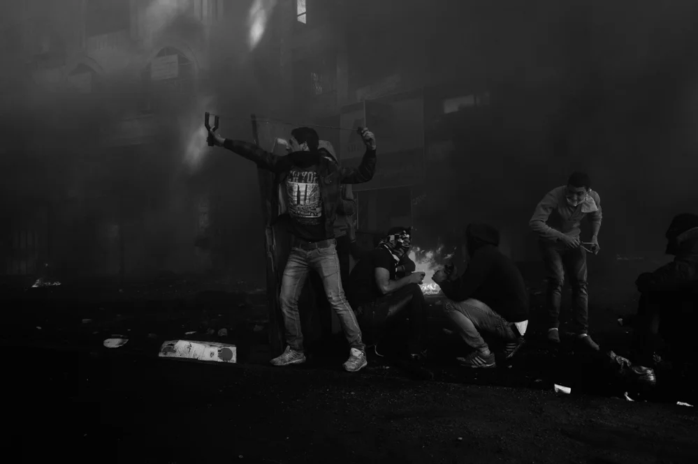  Palestinian stone thrower during clashes with the Israeli troops in Hebron. 