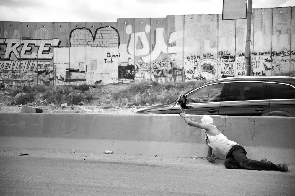  Palestinian demonstrators at Qalandiya checkpoint. 