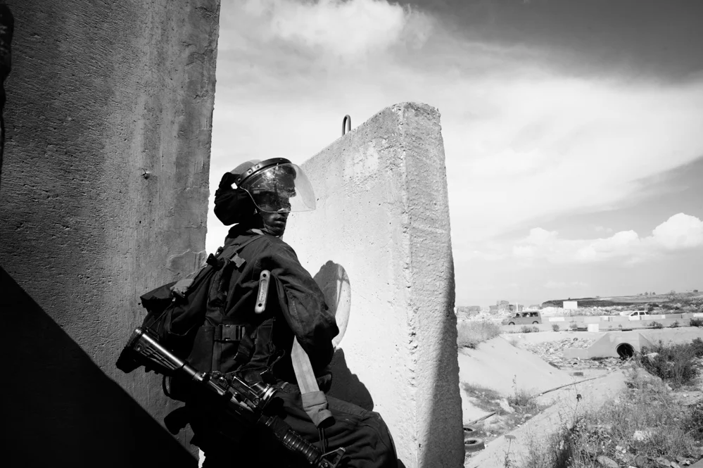 A moment of clashes at Qalandiya checkpoint between Palestinians and Israeli Police during the commemoration of the Nakba day. 
