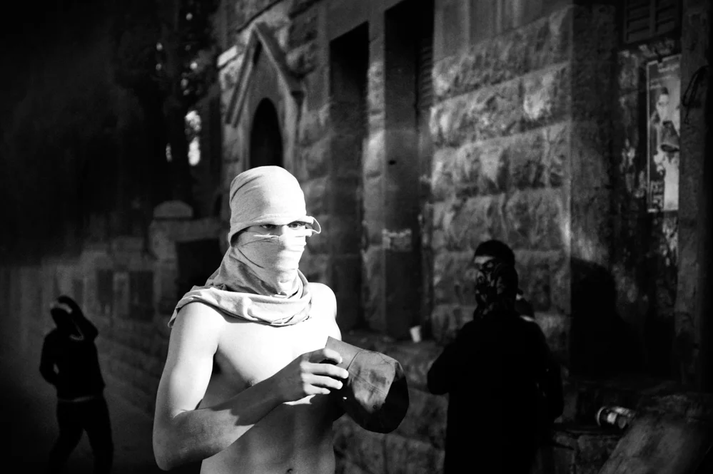  A Palestinian protester during clashes with the Israeli Police at Damascus Gate in Jerusalem. 