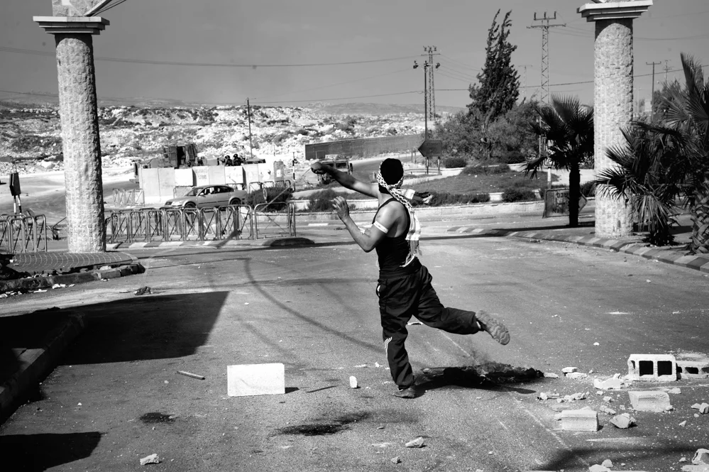  Palestinian clashes with the Israeli force after the Friday prayer. Al Ram village, Jerusalem. 