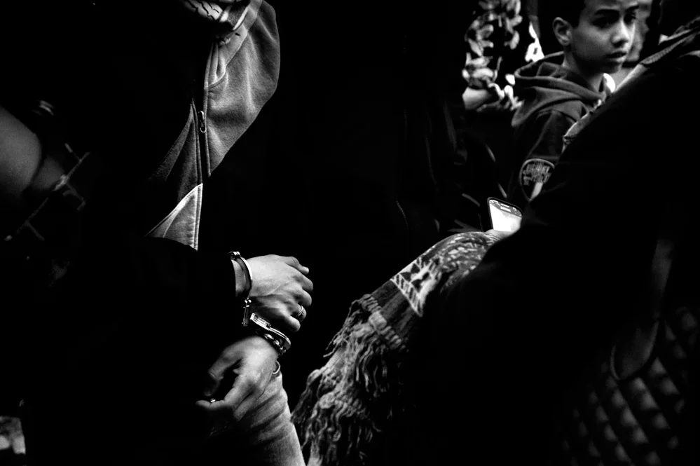  A young Palestinian is arrested during clashes with the Israeli police in the old City of Jerusalem. 