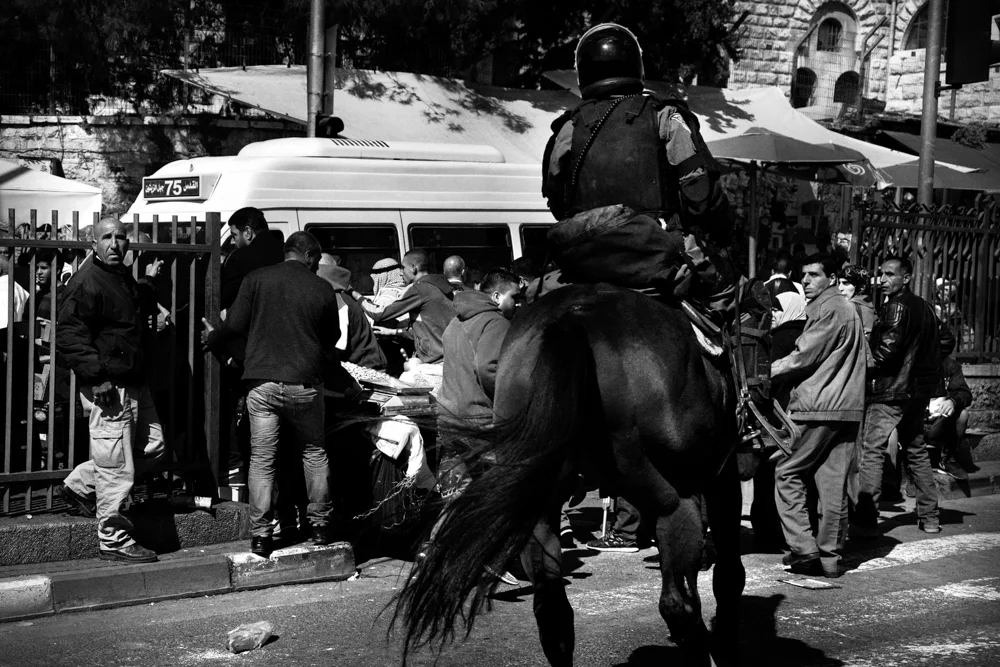  An Israeli police officer mounted on a horse dispersing the crowd at Damascus Gate during clashes with Palestinians. Disorders erupted after the Israel decision of impose entry restriction to the Holy City for the Friday prayers. 