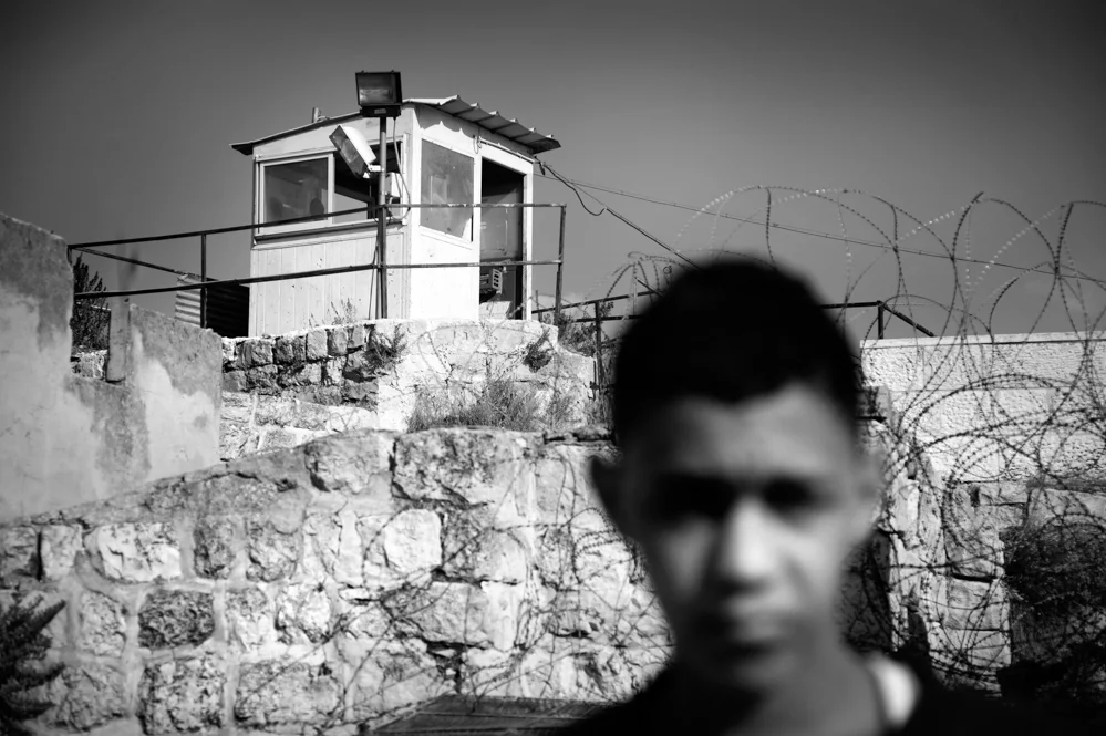  A Palestinian boy on the roof of his house in the old city of Hebron. 