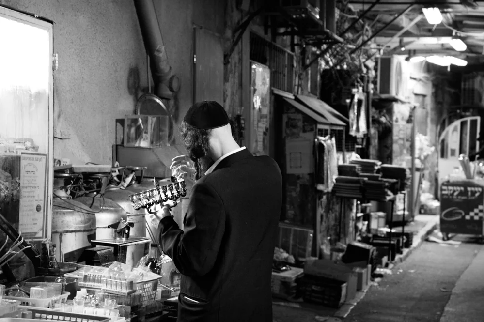  An Ultra Orthodox is seen buying a Menorah for the celebration of Hanukkah. Mea Shearim neighborhood. Jerusalem 