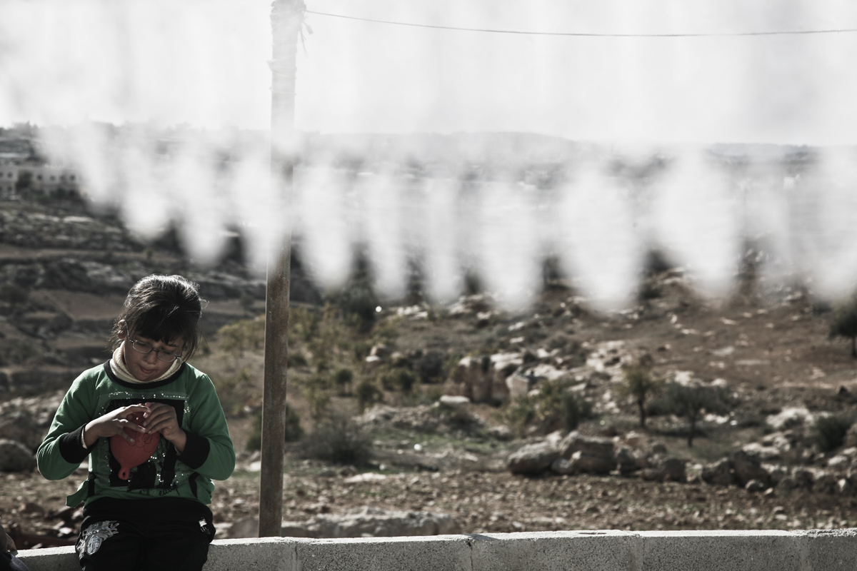 Fatima playing at her home. She is one of the beneficiaries of the educational program for disabled people supported by Handicap International in Yatta, Hebron district, occupied Palestinian territory.