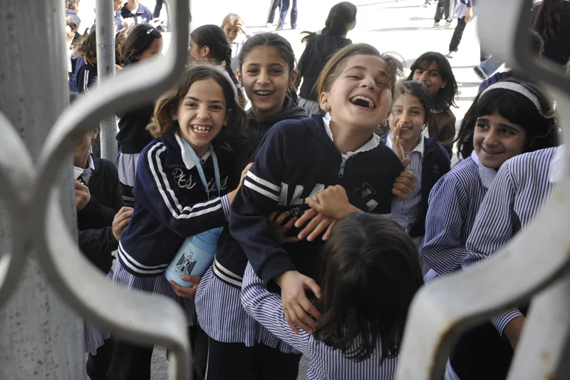 Student line up to buy homemade healthy snacks at subsidized prices. The goods are made by members of the School Canteen Cooperative of Kharas, Hebron district, West Bank. Local women supported by UNIFEM Palestine feed almost 70,000 schoolchildren n