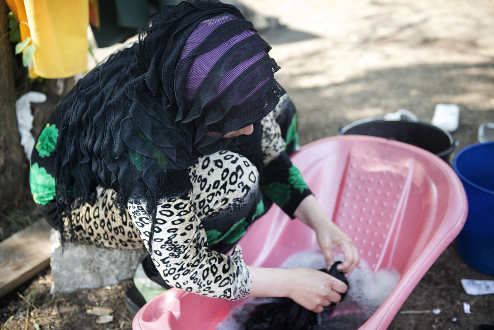 A woman washes clothes at the Kelebija border crossing in Serbia.