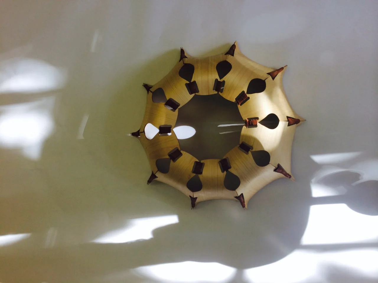  Birch aircraft ply, brown and red leather  This sculpture was made using bent lamination. It was directly inspired by a bird's eye socket but also draws inspiration from the significance of fractals in our natural surroundings.&nbsp; 