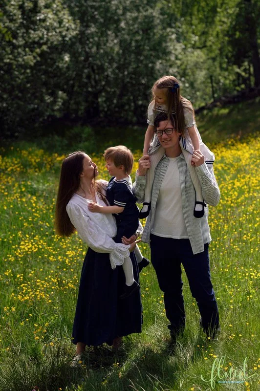 Family in buttercup field.