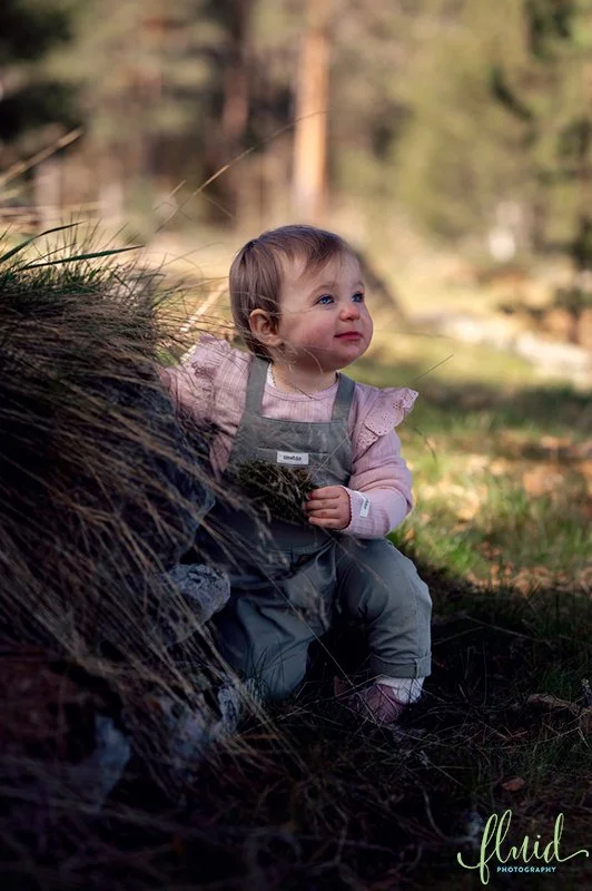 One year old crouching.