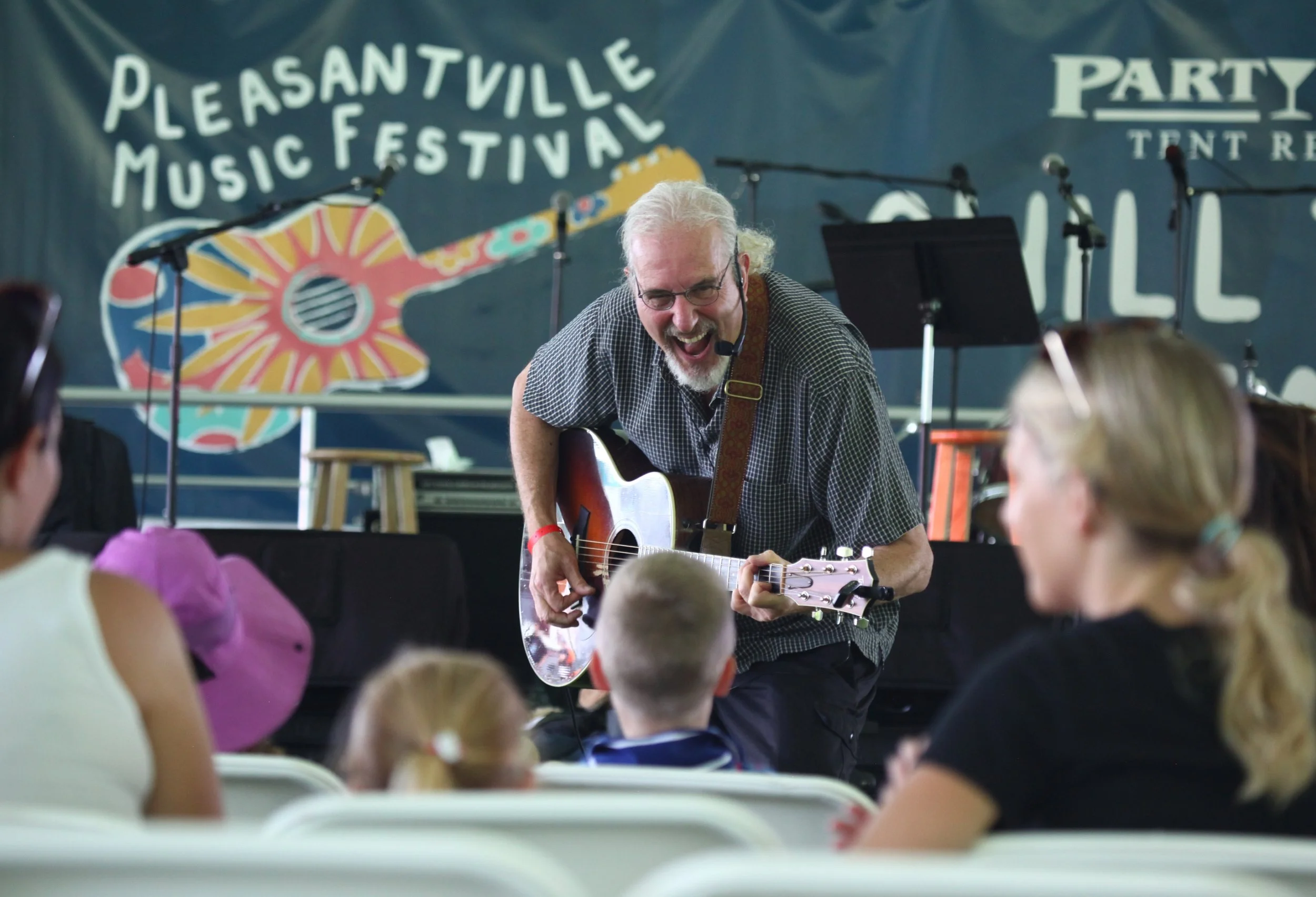 Robert The Guitar Guy starting off the day charming the children. @ 2026 Stuart Beyer
