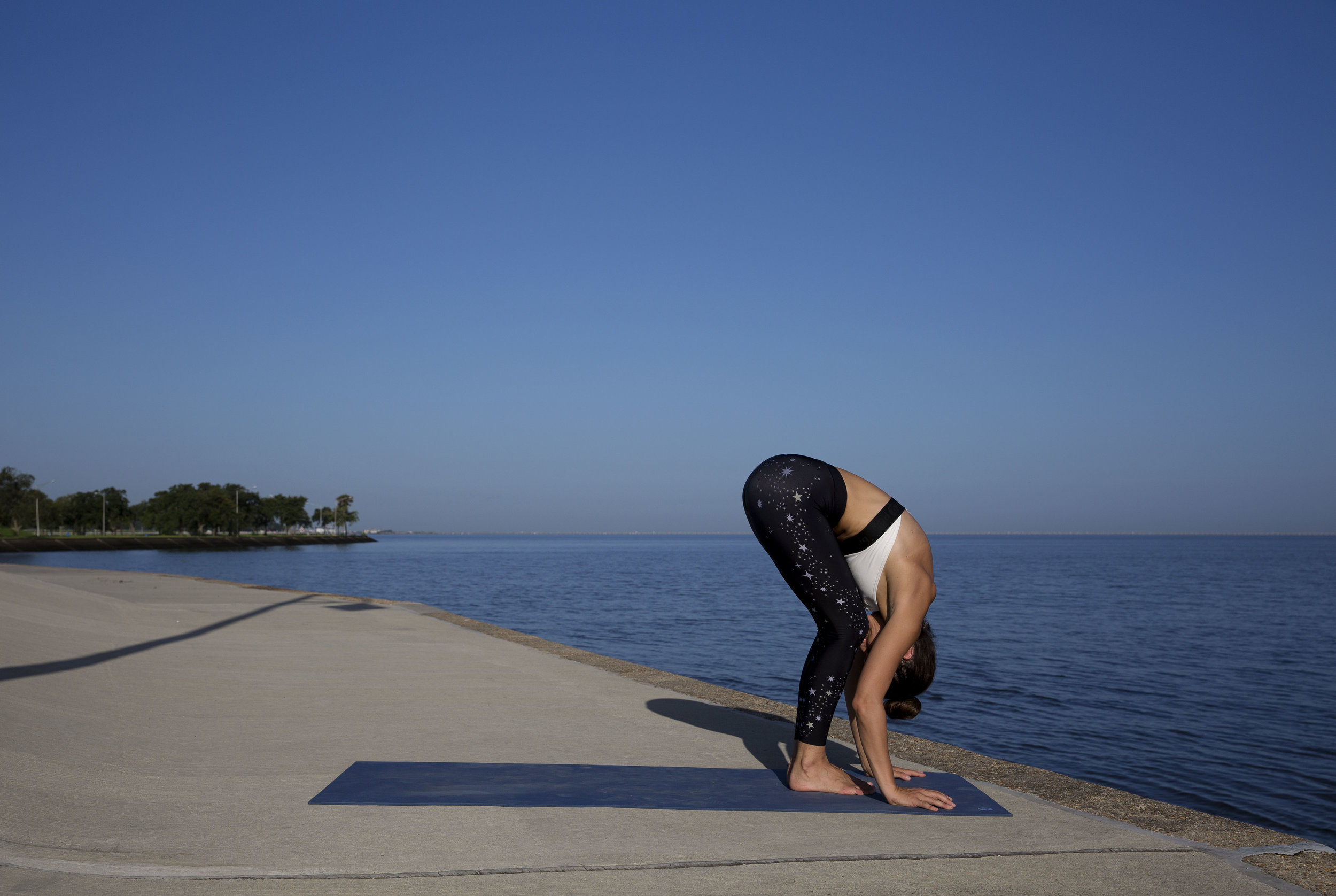 Exhale, fold. I have really tight hamstrings from knee injuries so I like to bend my legs and fold so I can get that connection between the thigh and belly. Inhale flat back (not pictured)