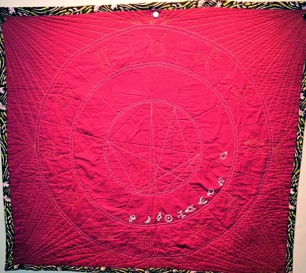 astro quilt on wall.jpeg