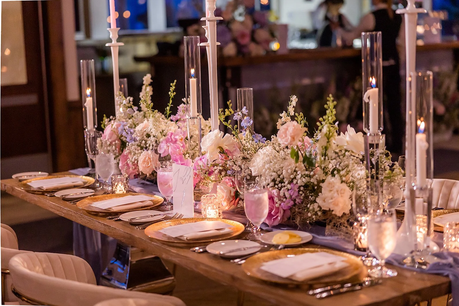 Long and low floral reception table at the Sundeck