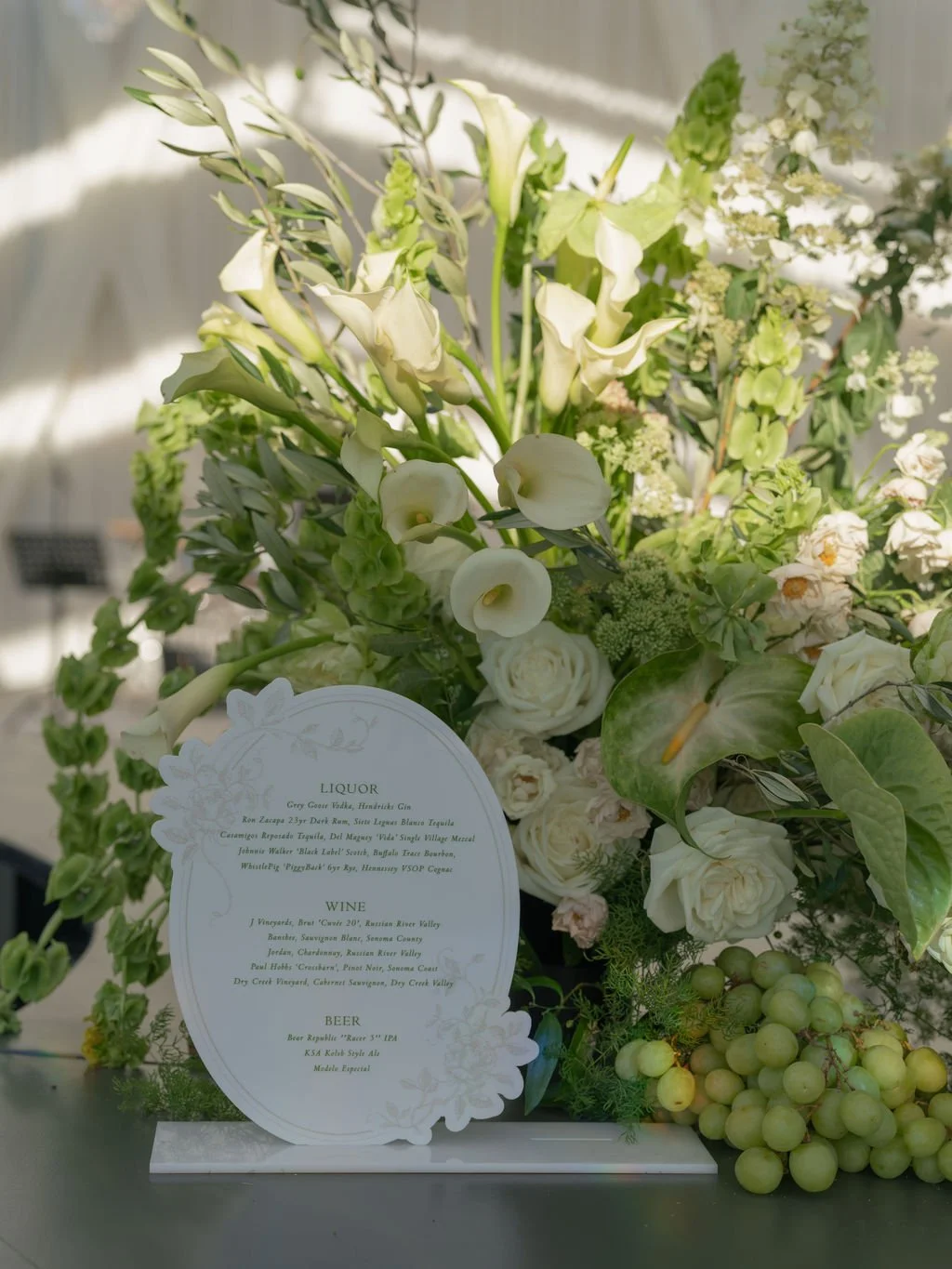 Wedding bar menu sign with calla lilies and green grapes