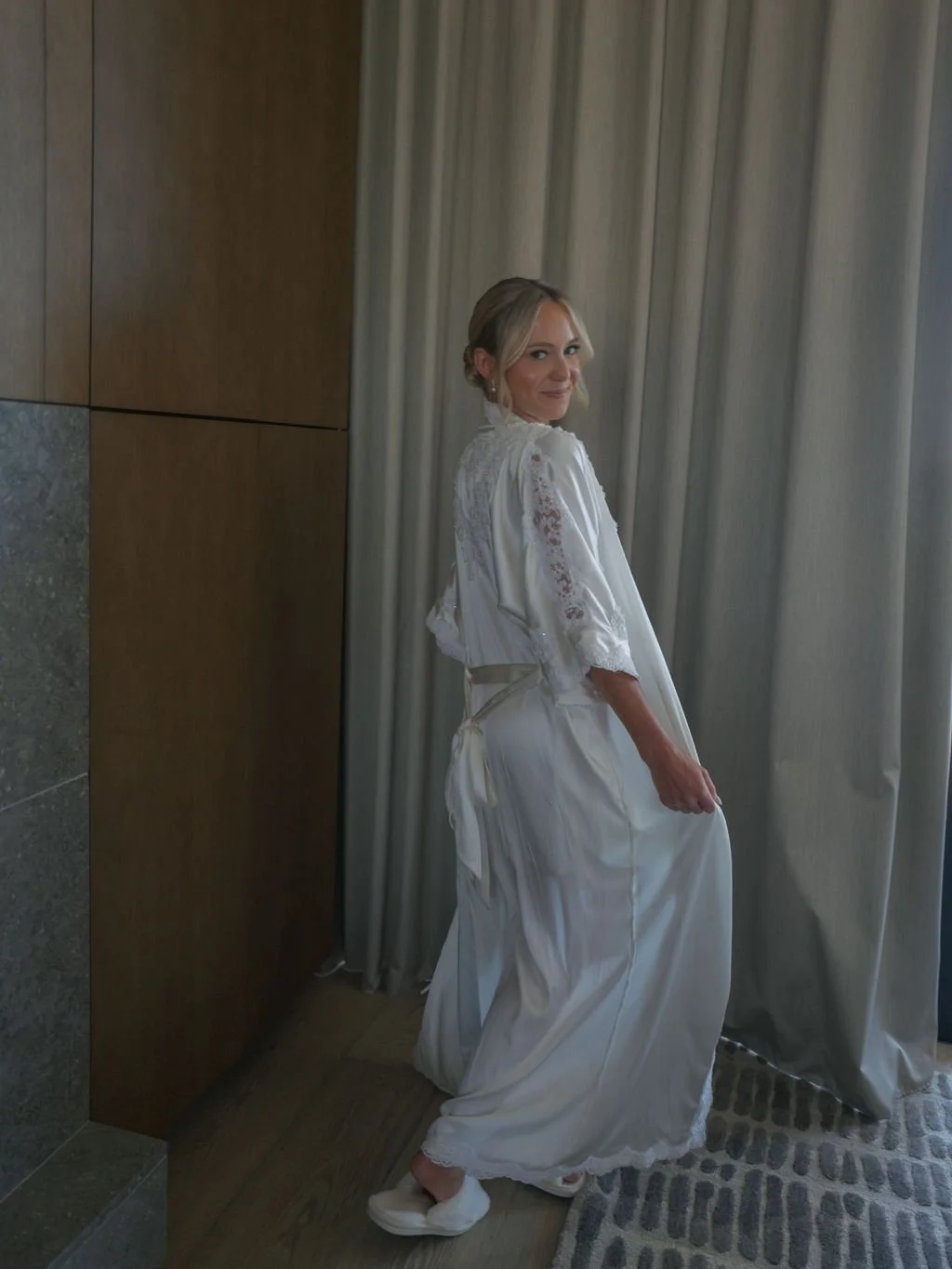 Bride getting ready in a silk robe at Montage Healdsburg