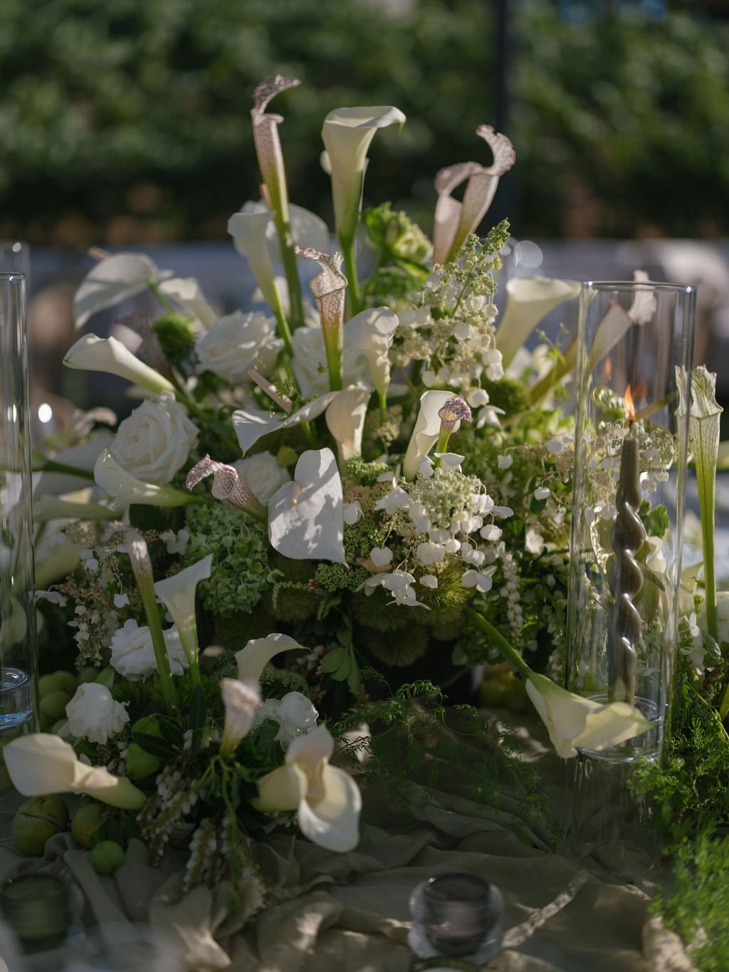 White calla lily wedding centerpiece with taper candle