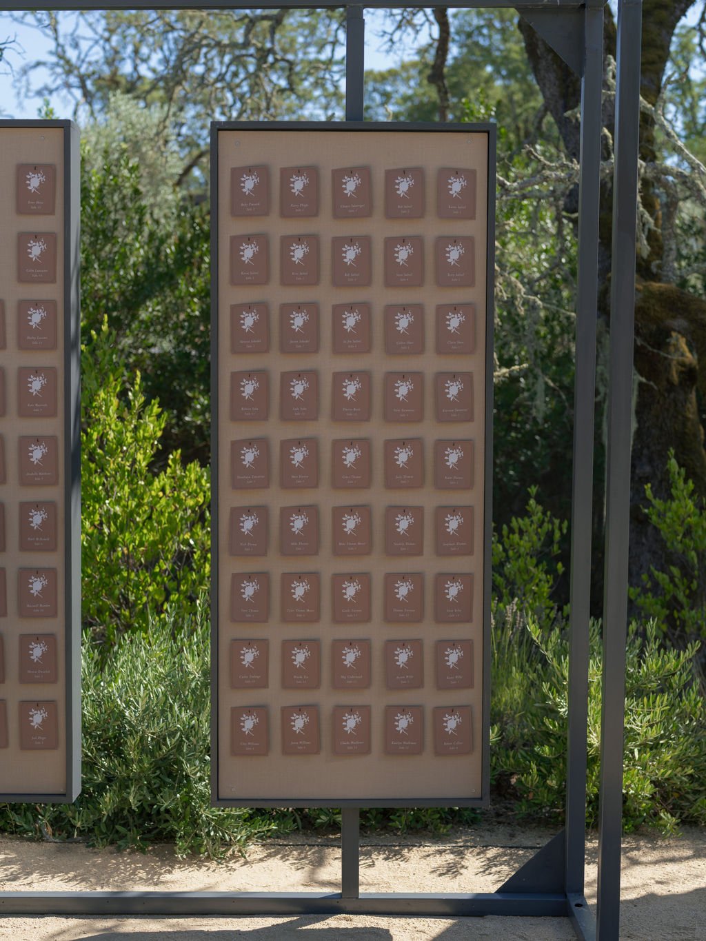 Wedding escort card display in the garden at Montage Healdsburg