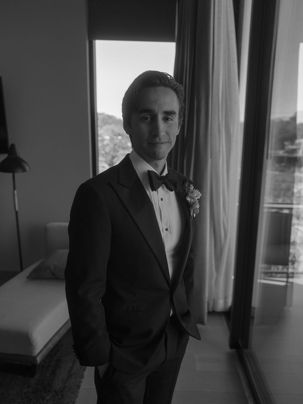 Black-and-white groom portrait in a tuxedo
