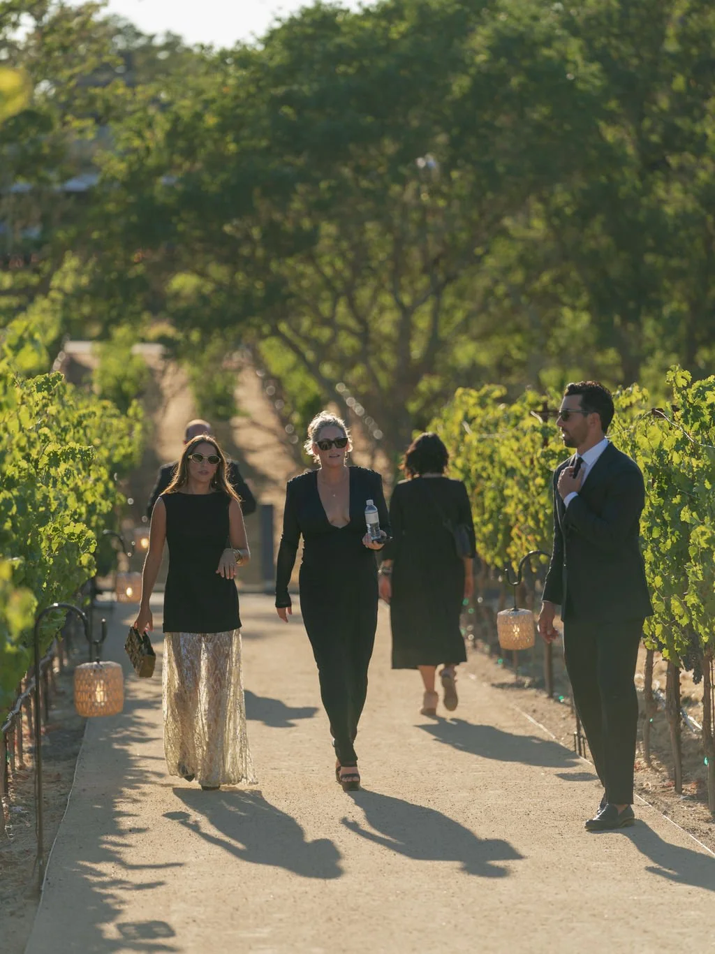 Wedding guests walking a vineyard path at Montage Healdsburg