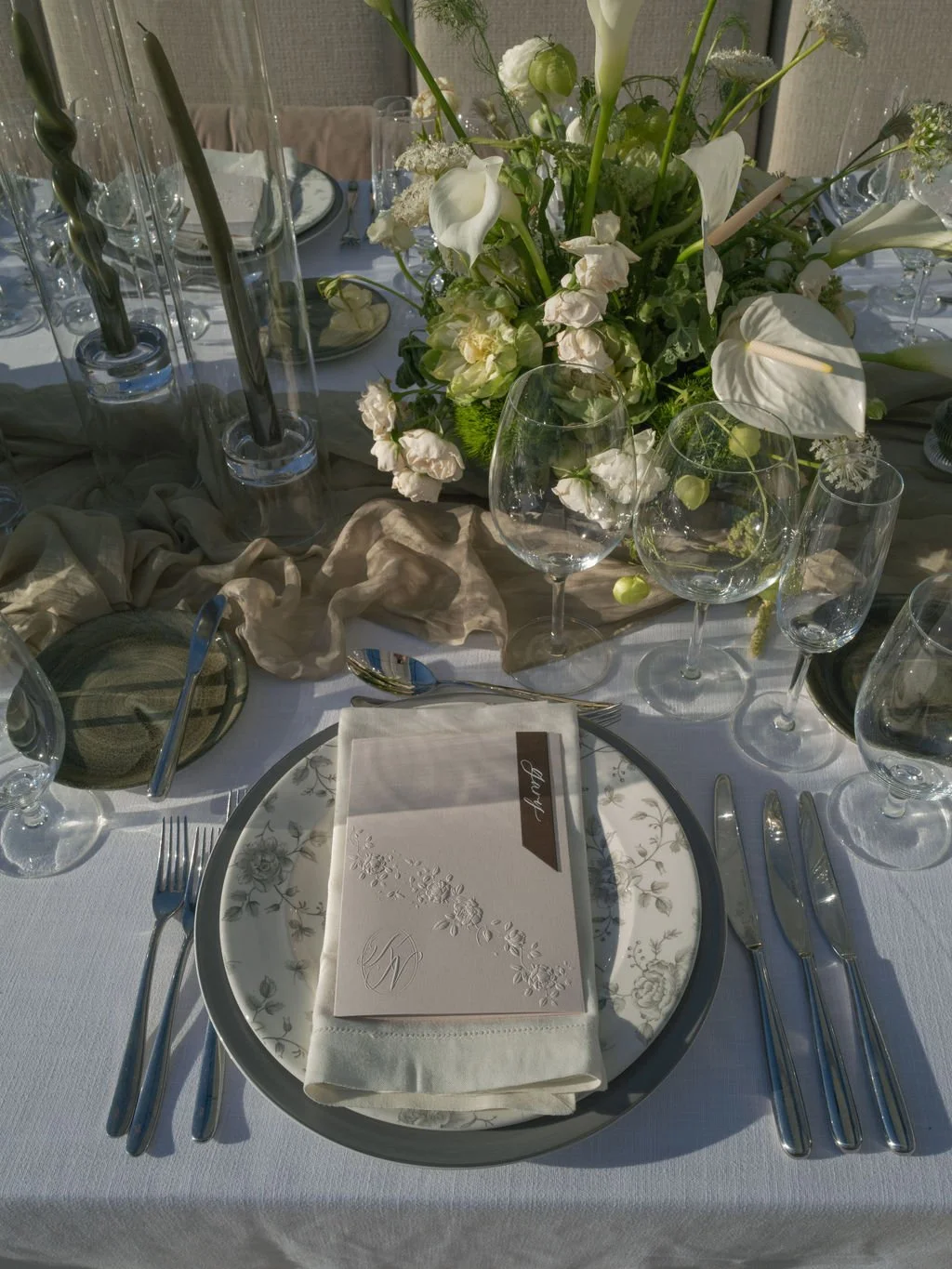 Wedding reception place setting with floral china and menu card