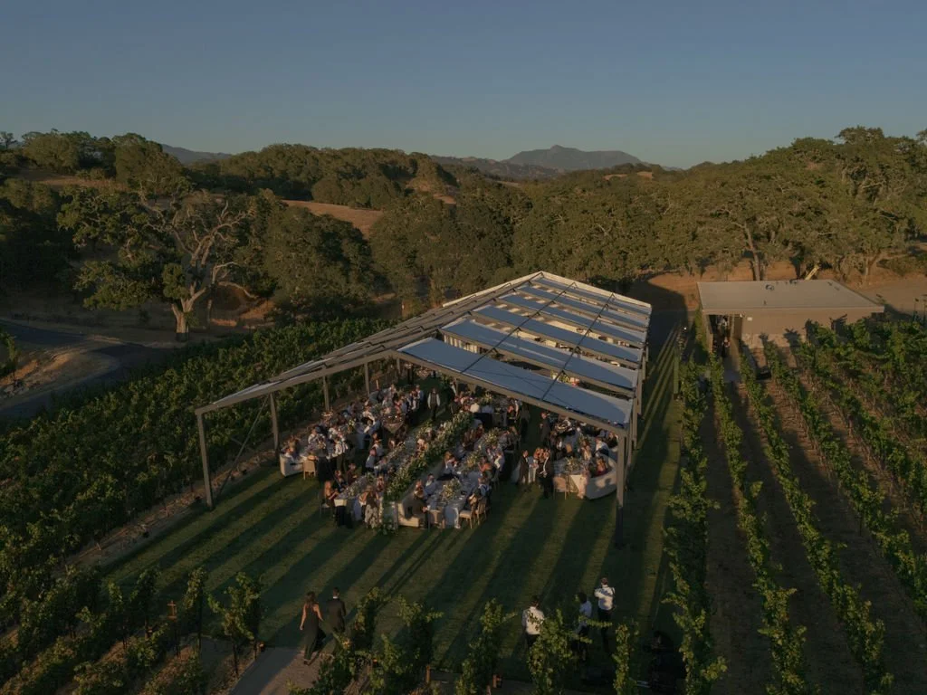 Vineyard wedding reception tent at dusk at Montage Healdsburg, by Piper &amp; Muse