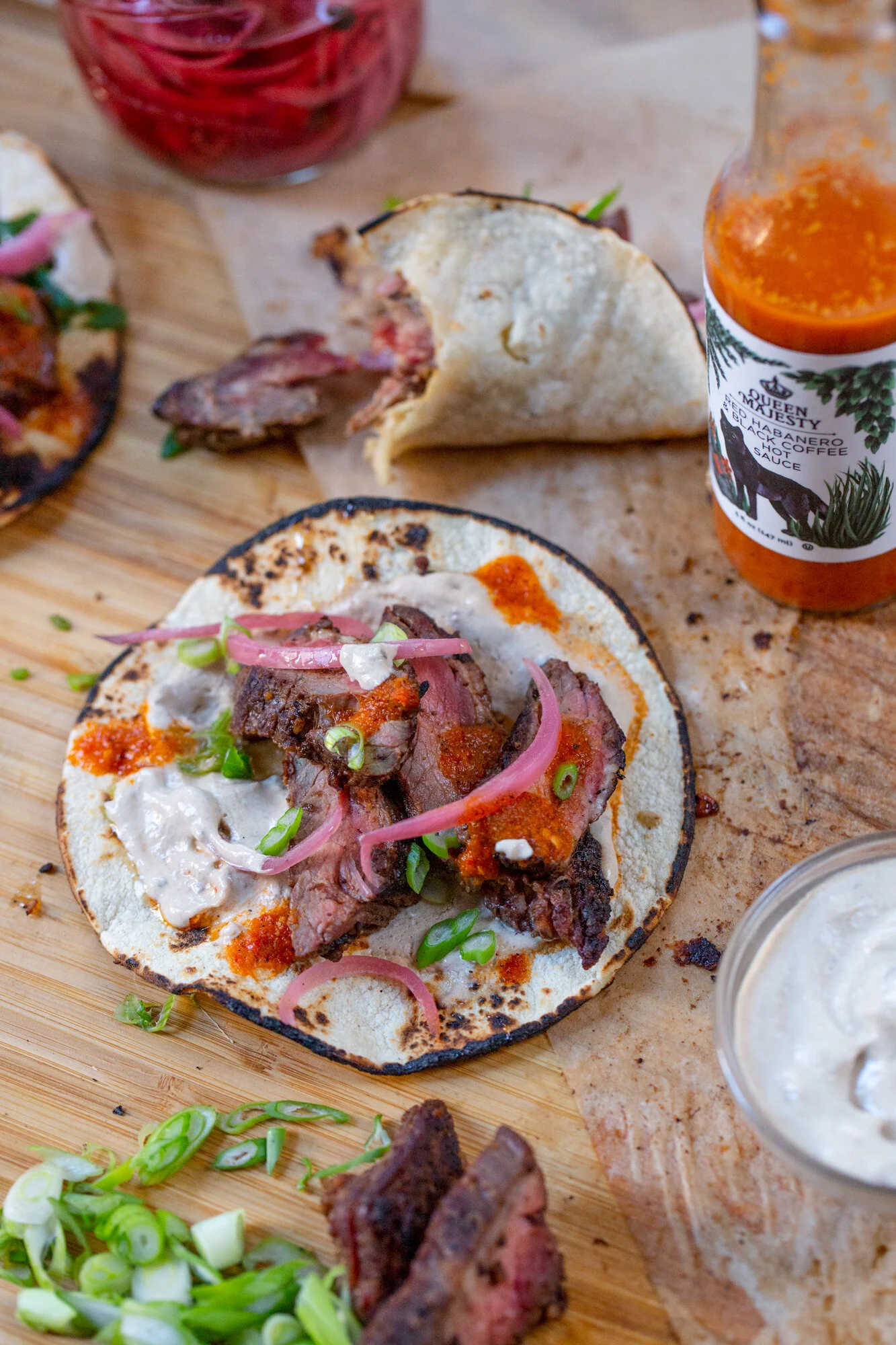 Sichuan Peppercorn Skirt Steak Tacos w. Black Garlic Labne, Scallions &amp; Honey