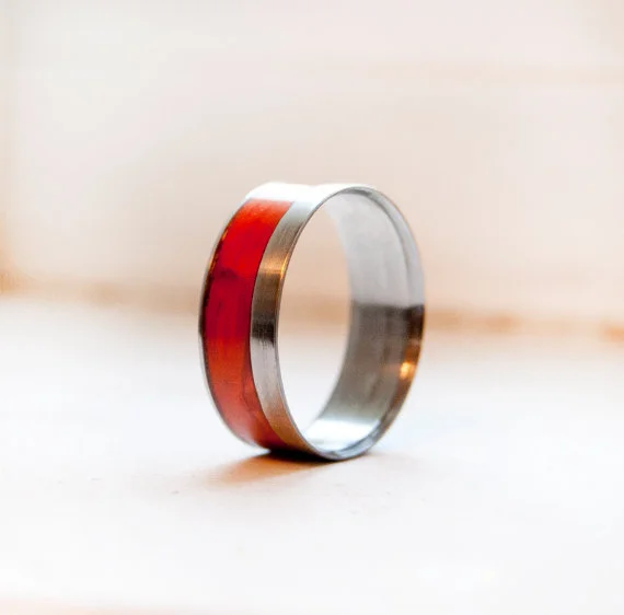 Handmade shaped and set wedding ring featuring padauk wood