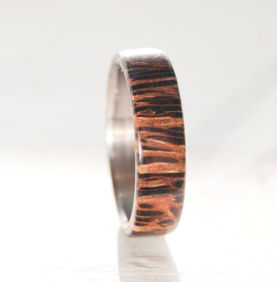 Wedding ring featuring a coconut wood overlay set on titanium.