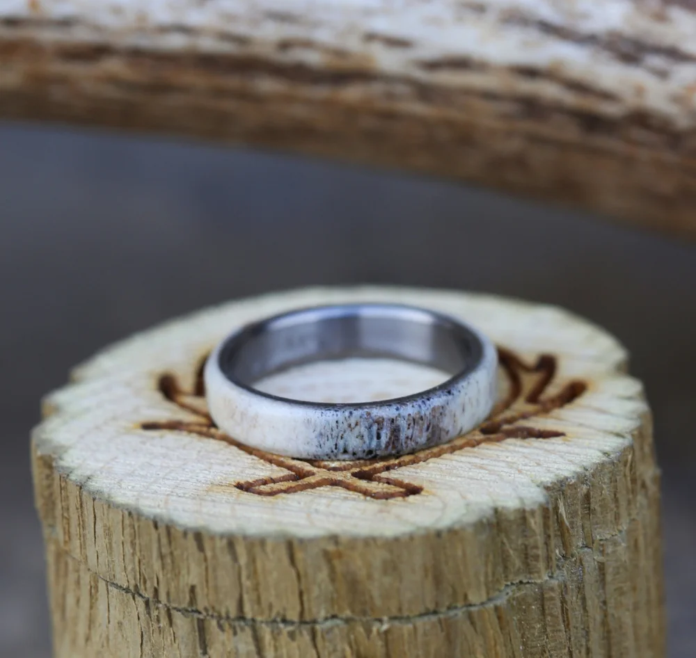 Men's wedding band handcrafted from elk antler and hand-turned titanium.