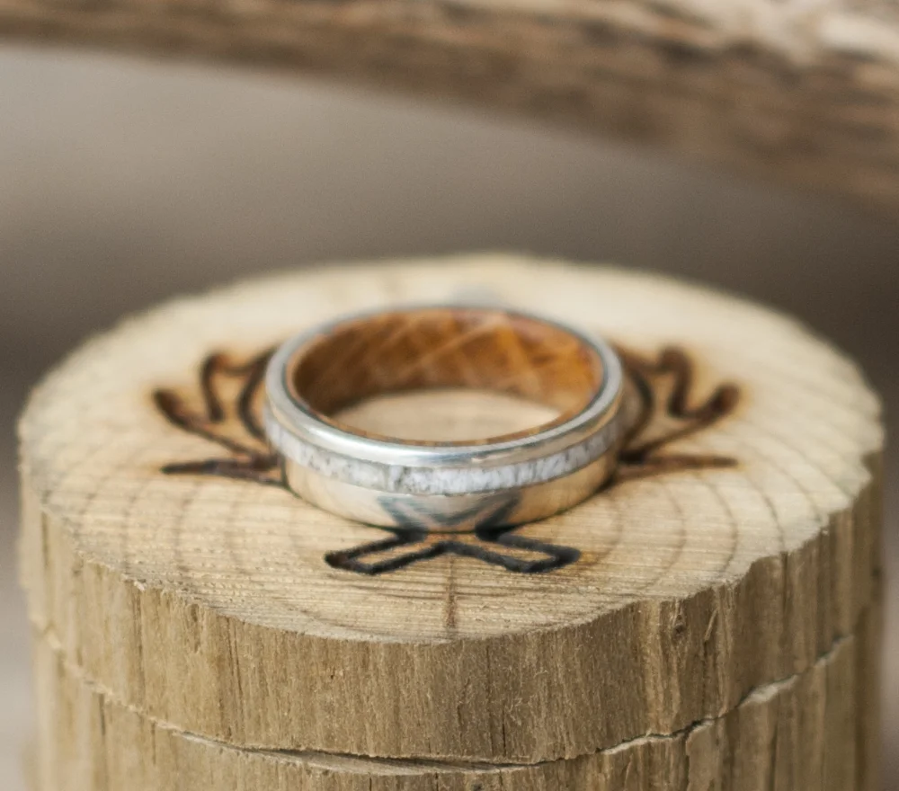 Custom men's wedding band, handcrafted from whiskey barrel wood and elk antler.