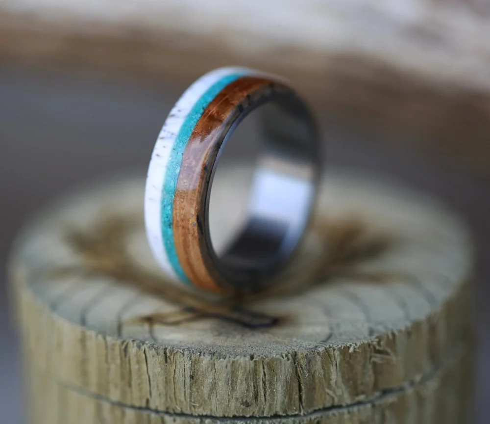 Custom men's wedding band with whiskey barrel oak, turquoise, and antler. Handcrafted by Staghead Designs.
