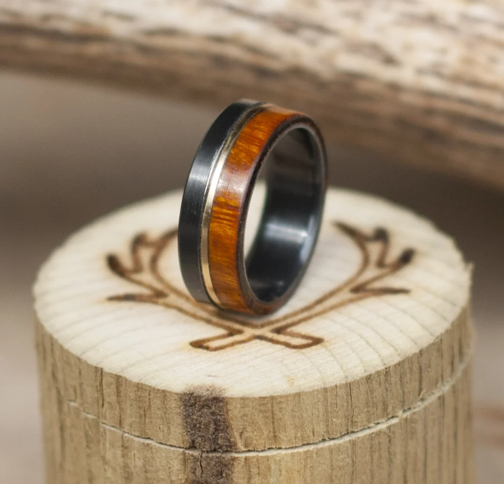 handmade wedding band with wood and gold inlays.