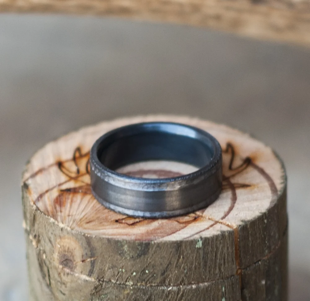 Copy of Black zirconium wedding ring with hand hammered edges.