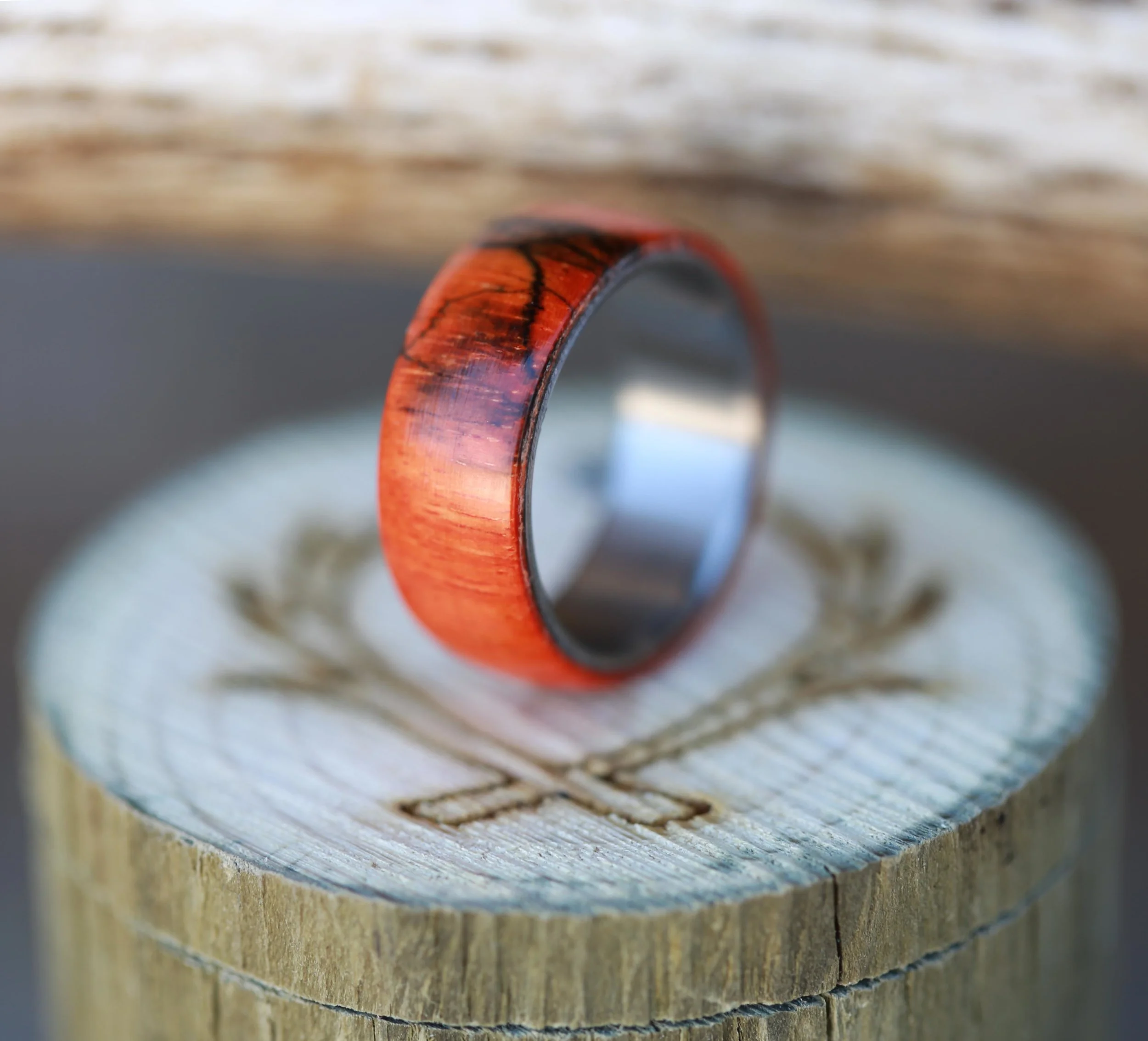 Men's Wedding Band Featuring Orange Spalted Maple & Titanium. Handcrafted by Staghead Designs.