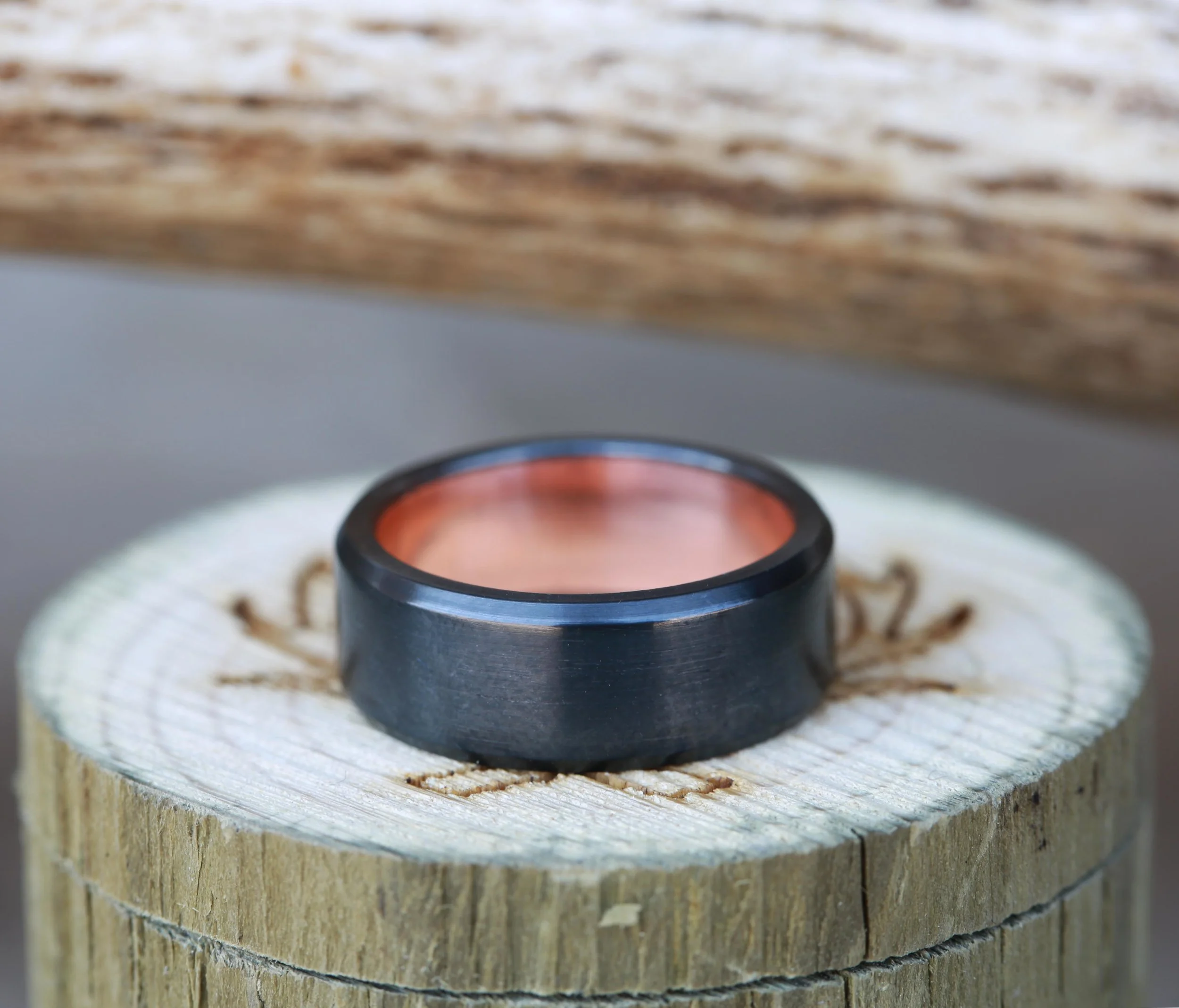 10k Rose Gold Lined Band Featuring Black Zirconium. Handcrafted by Staghead Designs.