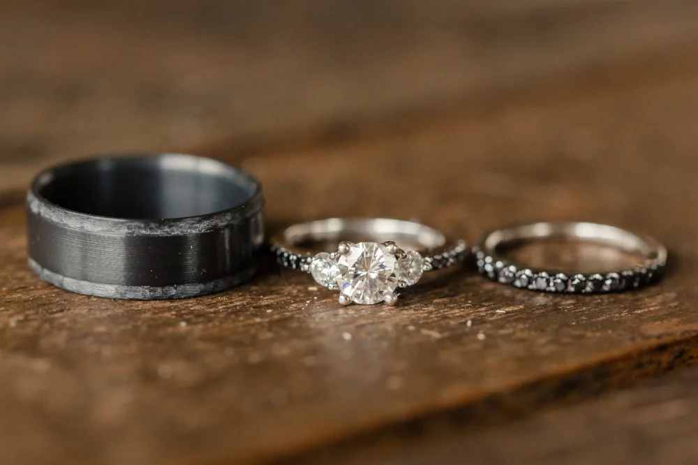 Copy of Men's Black Wedding Band with Hammered Edges by Staghead Designs. Photo by Figlewicz Photography.
