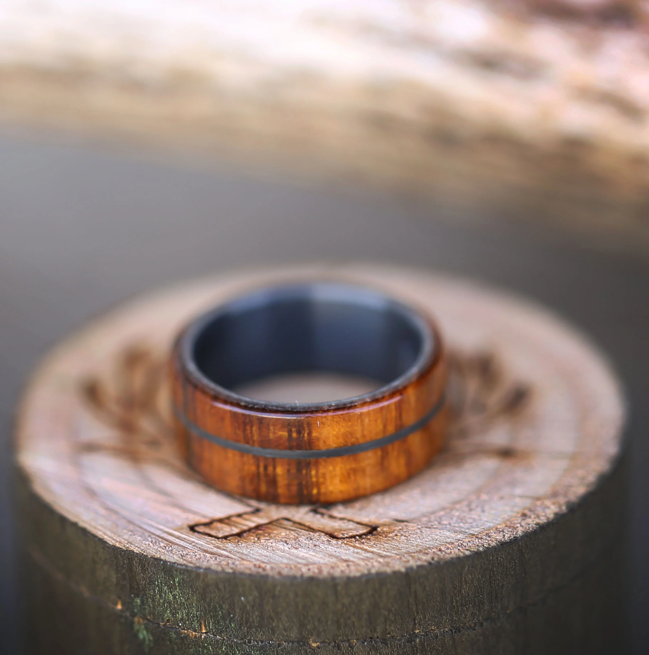 Black Wedding Ring for Men with Wood Overlays. Handcrafted by Staghead Designs.