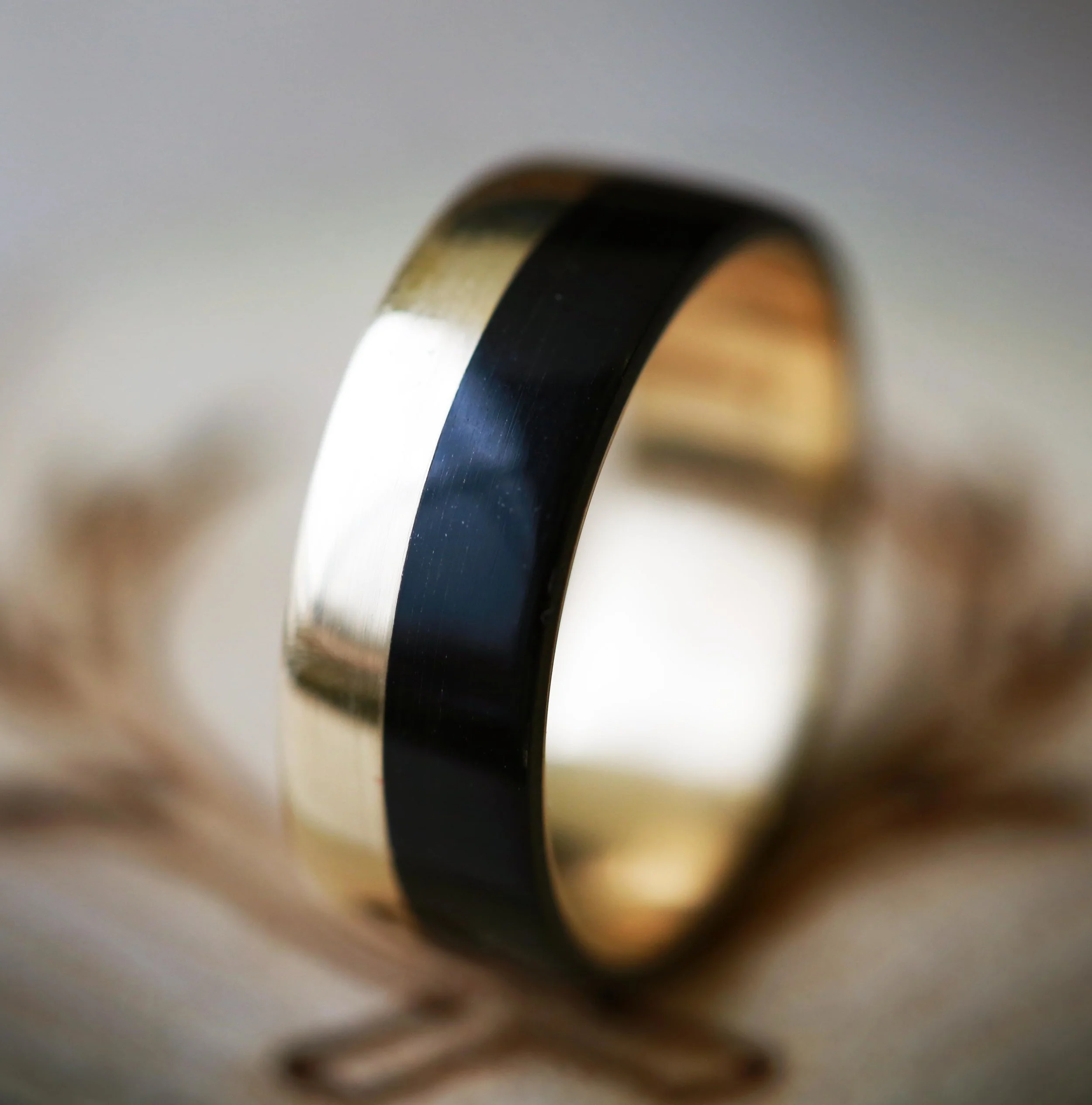 Men's Wedding Ring with Ebony Wood and Gold. Handcrafted by Staghead Designs.