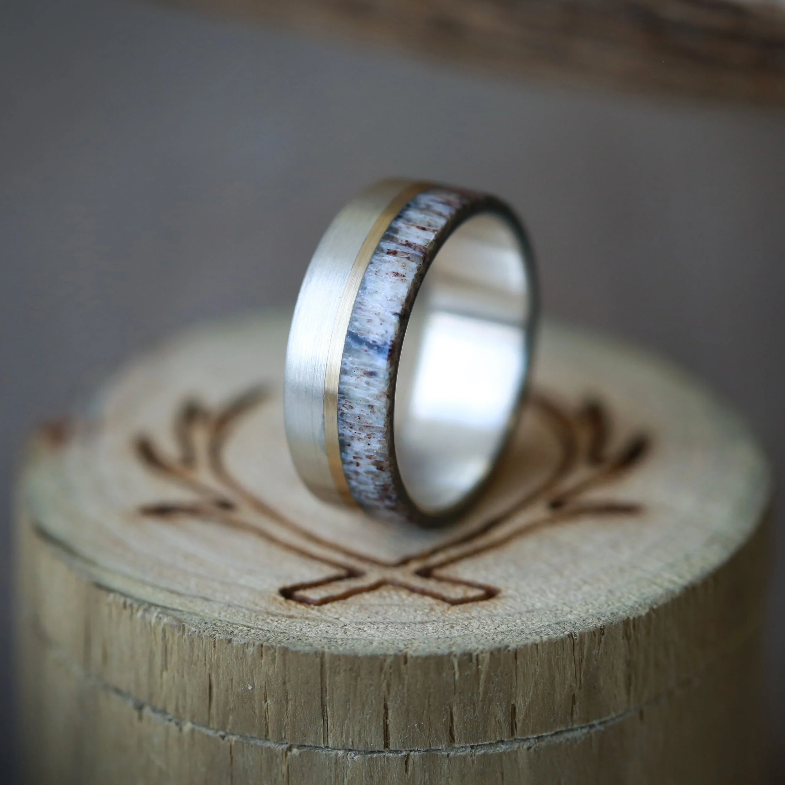 Brushed Silver, Gold, and Antler Wedding Ring for Men. Handcrafted by Staghead Designs.
